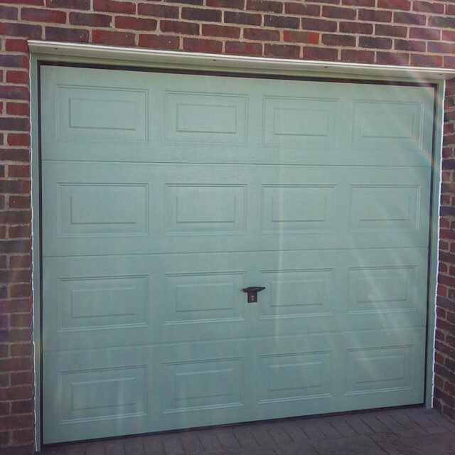 Single green insulated garage door.