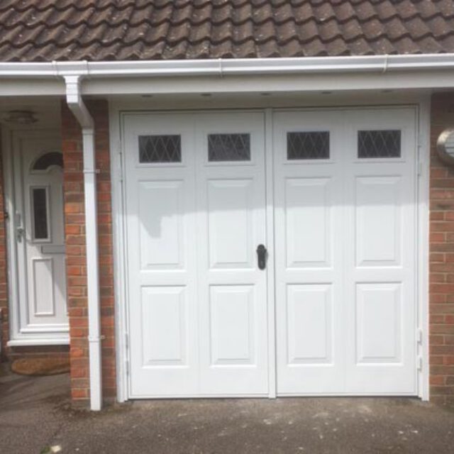 Single white side hinged garage door.