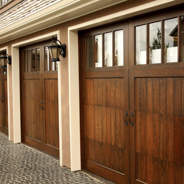 Three wooden garage doors.
