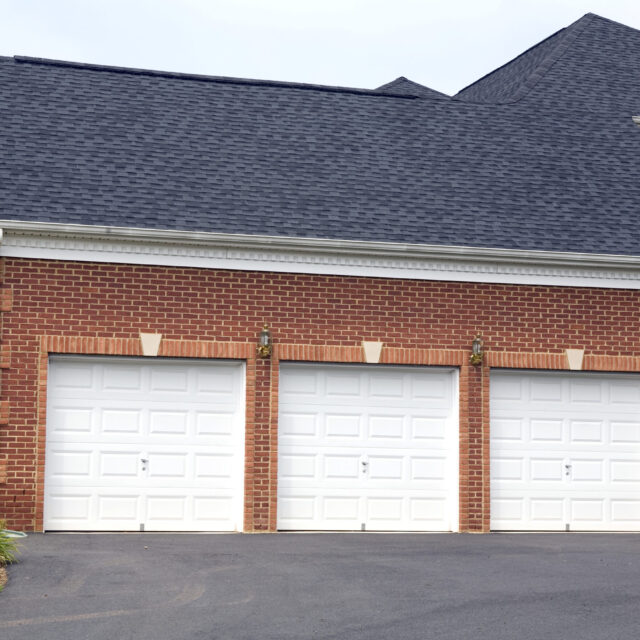 Three white garage doors.